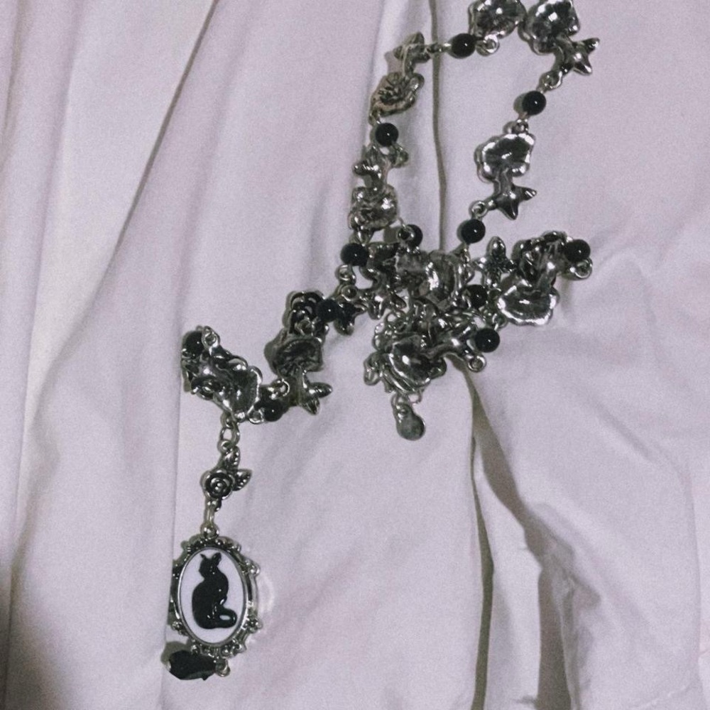 SOLD earthbound silver + white black cat pendant